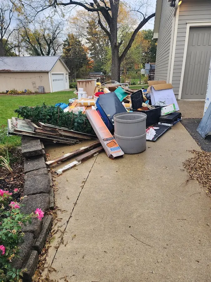 Dumpster being loaded with debris for 10 Yard Dumpster Rental in New Cumberland